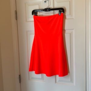 Fluorescent pink strapless mini dress